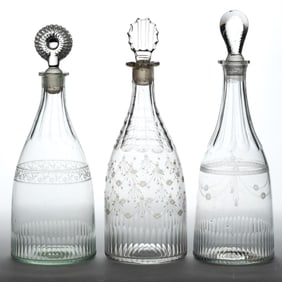 FREE-BLOWN AND ENGRAVED GLASS DECANTERS, LOT OF THREE