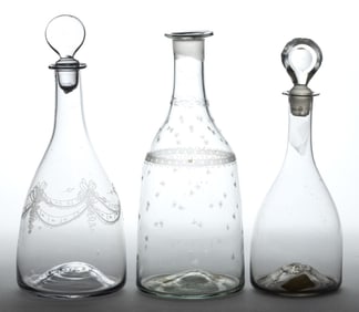 FREE-BLOWN AND ENGRAVED GLASS DECANTERS, LOT OF THREE