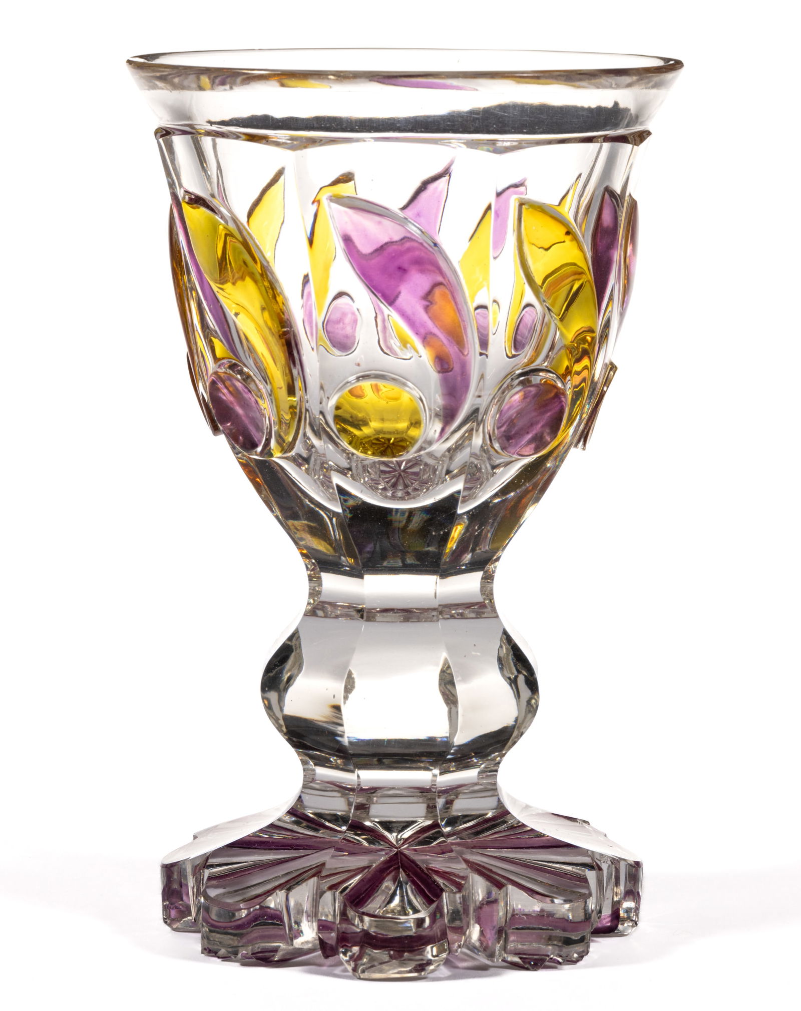 BOHEMIAN BIEDERMEIER CUT AND STAINED GLASS GOBLET: BOHEMIAN BIEDERMEIER CUT AND STAINED GLASS GOBLET, colorless, conical bowl with eight cut panels with each holding an amber and amethyst-stained whirl with the panels running down the standard and ter