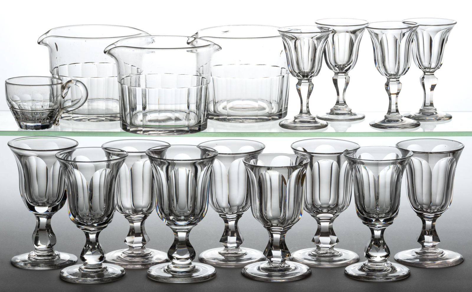 ASSORTED CUT GLASS DRINKING ARTICLES, LOT OF 17: ASSORTED CUT GLASS DRINKING ARTICLES, LOT OF 17, colorless lead glass, comprising nine champagnes with flute cuts, four wines with flute cuts, three wine rinsers with basal panel cuts, and a punch cup