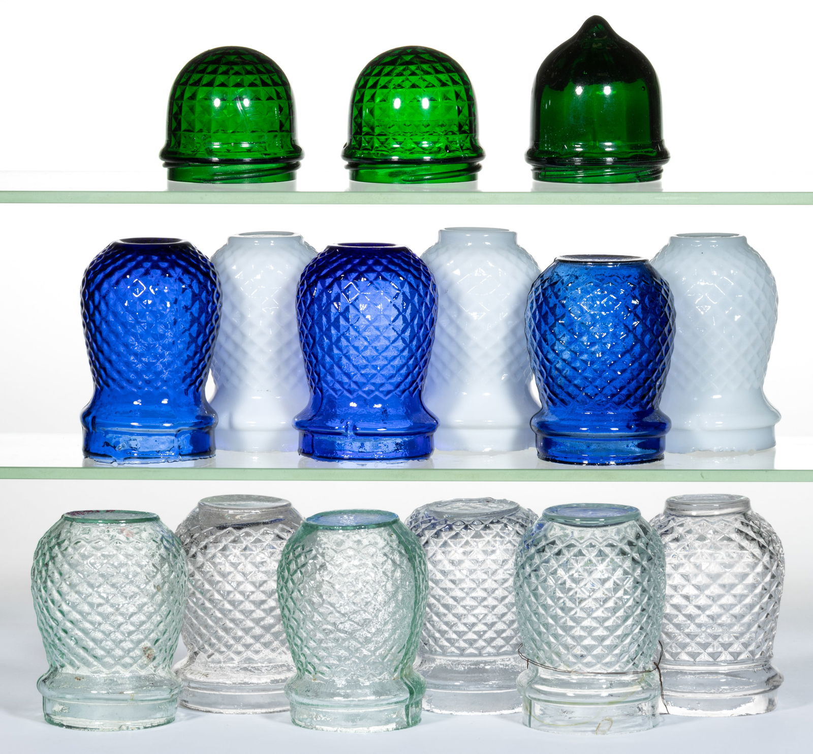 ASSORTED GLASS CHRISTMAS LIGHTS, LOT OF 15: ASSORTED GLASS CHRISTMAS LIGHTS, LOT OF 15, various colors, including two Diamond-pattern examples. Various makers. 19th and 20th century. 2 1/2" to 3 7/8" H. 