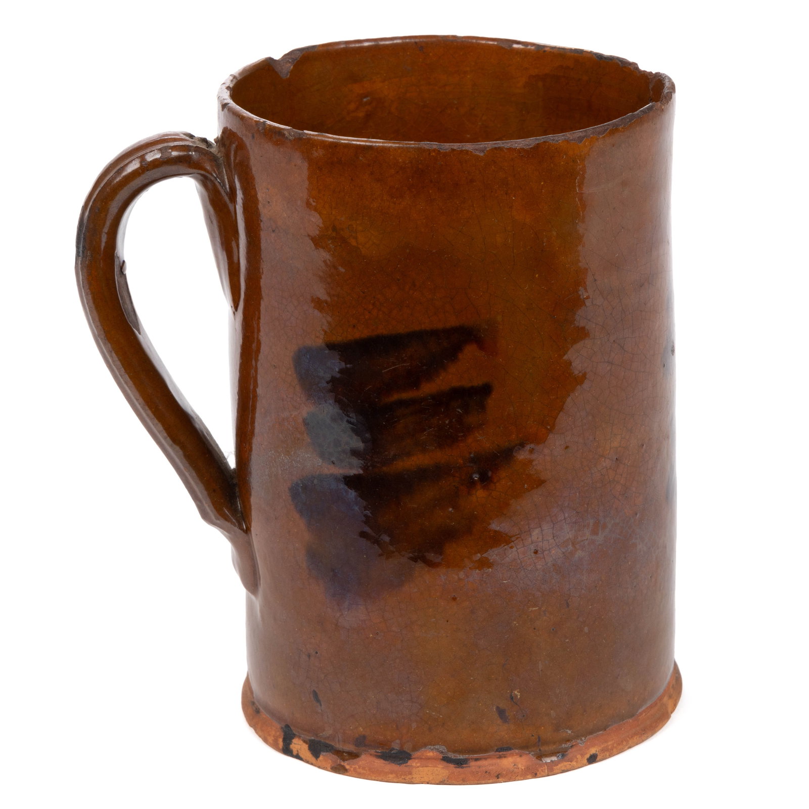 PENNSYLVANIA EARTHENWARE / REDWARE MUG / TANKARD: PENNSYLVANIA EARTHENWARE / REDWARE MUG / TANKARD, lead-glazed with three manganese splotches, cylindrical form with applied strap handle having medial ridge. First half 19th century. 6 1/4" H, 4