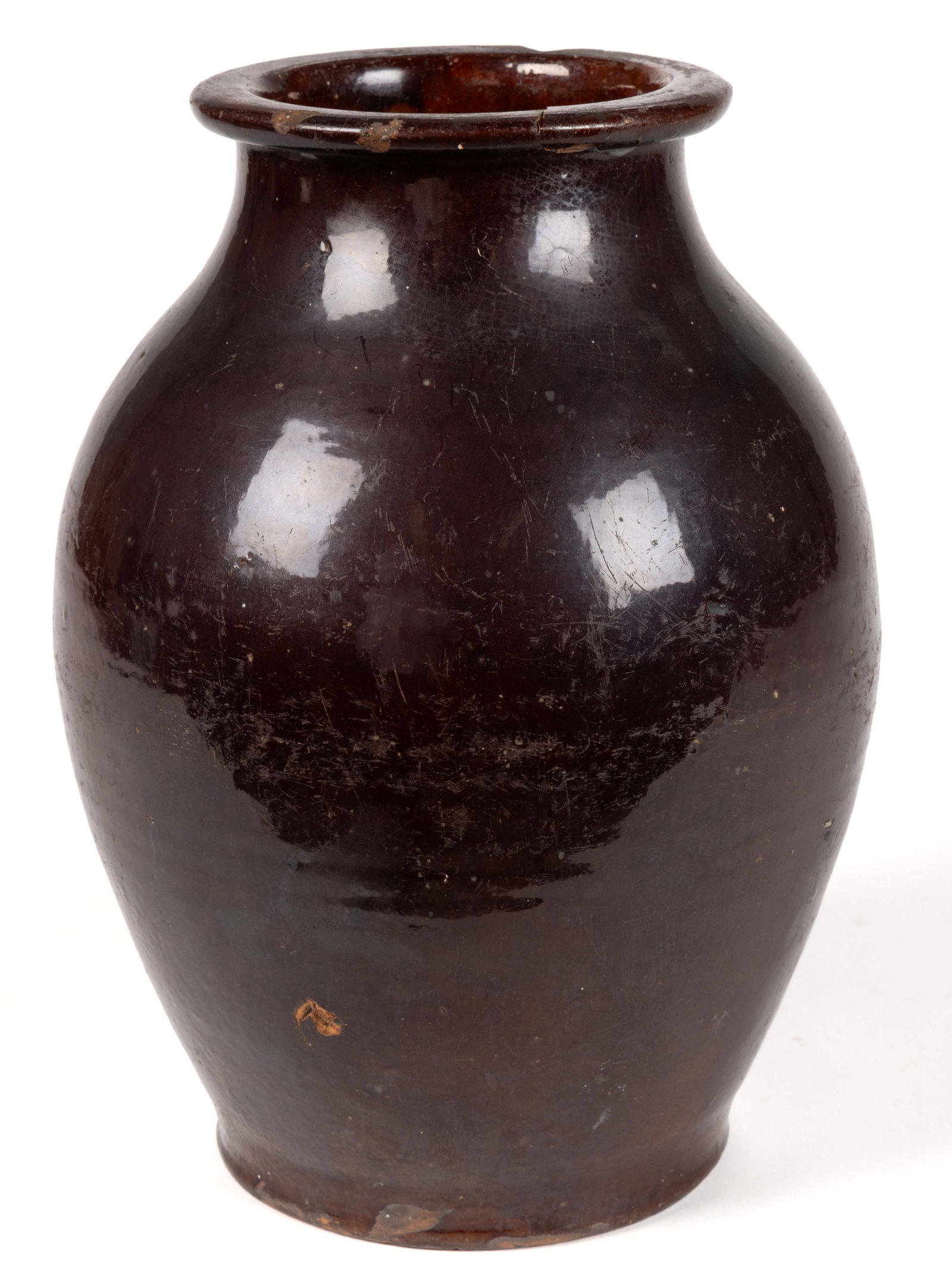 SHENANDOAH VALLEY OF VIRGINIA ATTRIBUTED EARTHENWARE / REDWARE JAR: SHENANDOAH VALLEY OF VIRGINIA ATTRIBUTED EARTHENWARE / REDWARE JAR, lead- and manganese-glazed, ovoid form with flattened rim. Possibly Winchester, VA. Circa 1825. 10 3/4" H, 5 1/8" D r