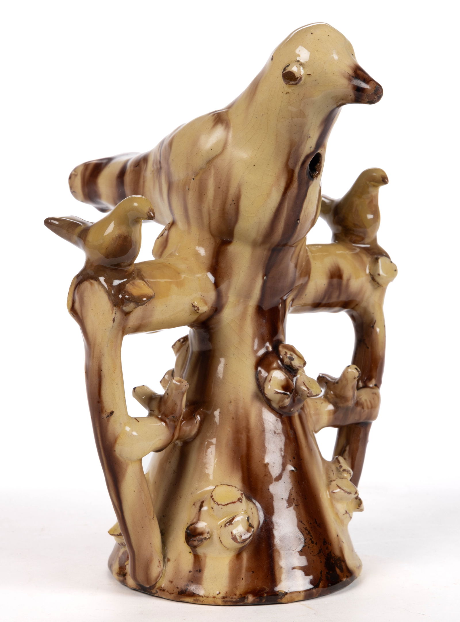 ENGLISH POTTERY EARTHENWARE / REDWARE LARGE BIRD WHISTLE: ENGLISH POTTERY EARTHENWARE / REDWARE LARGE BIRD WHISTLE, lead- and manganese-glazed over a slip wash, modeled as a cuckoo/pigeon on a branch, above a conical base, with smaller birds modeled to eithe