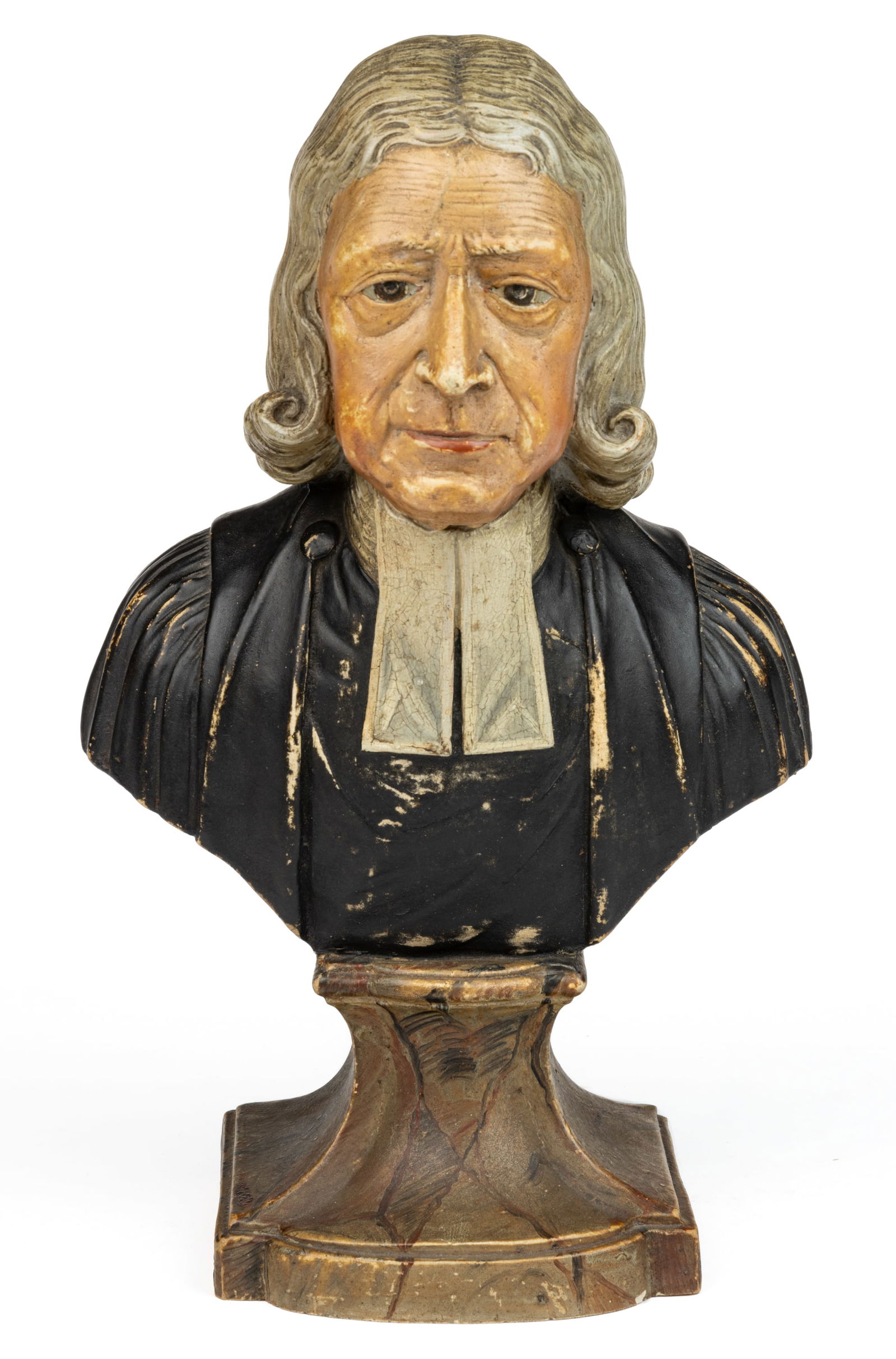 BRITISH HAND-PAINTED JOHN WESLEY CERAMIC BUST: STAFFORDSHIRE HAND-PAINTED JOHN WESLEY CERAMIC BUST, polychrome enamel decorations, featuring an older grey-haired religious figure known as the founder of Methodism, sitting atop an integral plinth,