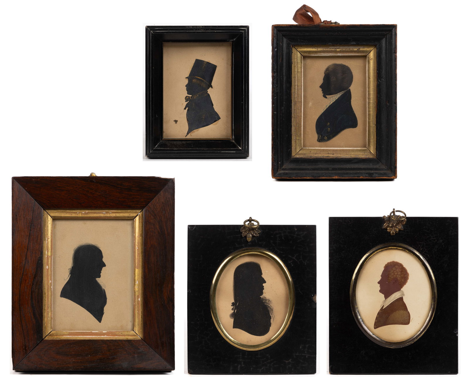 AMERICAN OR BRITISH SCHOOL (19TH CENTURY) FOLK ART SILHOUETTES, LOT OF FIVE: AMERICAN OR BRITISH SCHOOL (19TH CENTURY) FOLK ART SILHOUETTES, LOT OF FIVE, oil or watercolor on paper, comprising depictions of men at various ages, the youngest wears a large top hat. Each are