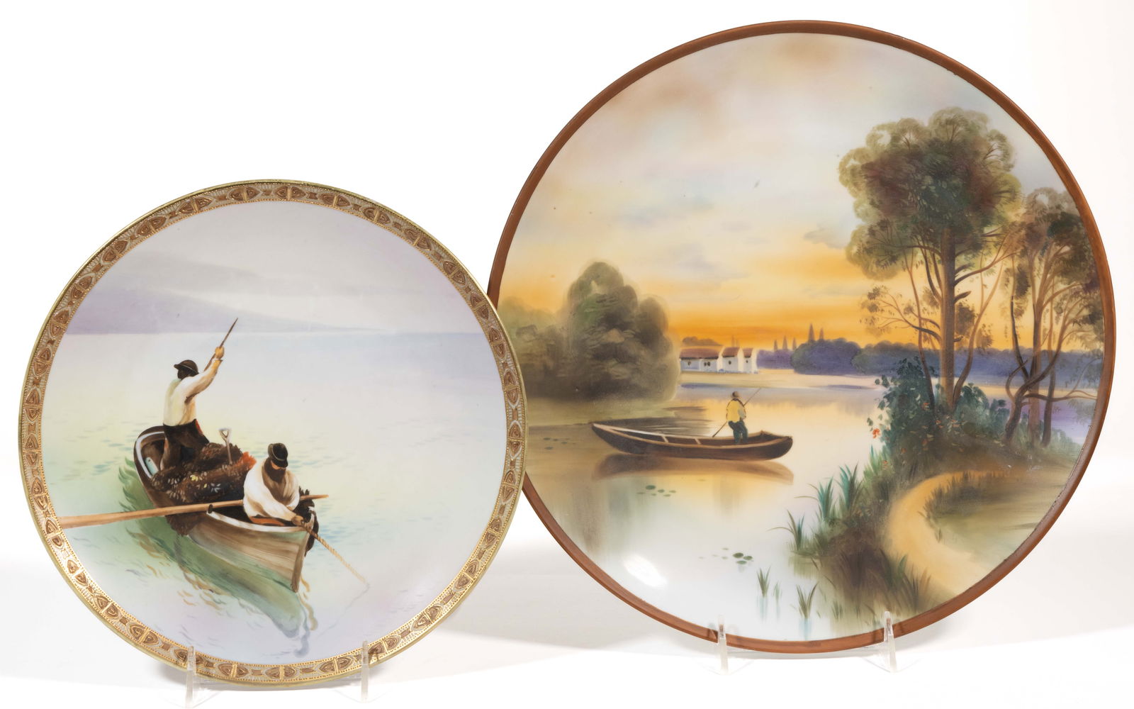 JAPANESE NIPPON PORCELAIN BOAT MOTIF PLAQUES, LOT OF TWO: JAPANESE NIPPON PORCELAIN BOAT MOTIF PLAQUES, LOT OF TWO, each having polychrome hand-painted water landscape scenes, comprising one example depicting two figures in a small boat with raised gilt bord