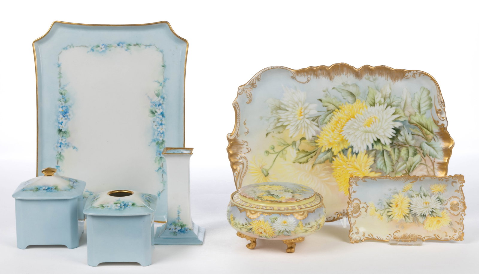 CONTINENTAL LIMOGES PORCELAIN HAND-PAINTED DRESSER SETS, LOT OF TWO: CONTINENTAL LIMOGES PORCELAIN HAND-PAINTED DRESSER SETS, LOT OF TWO, comprising a four-piece set featuring delicate blue flower motif including a 10 1/4" x 7 7/8" tray, a hair receiver, a covered box,