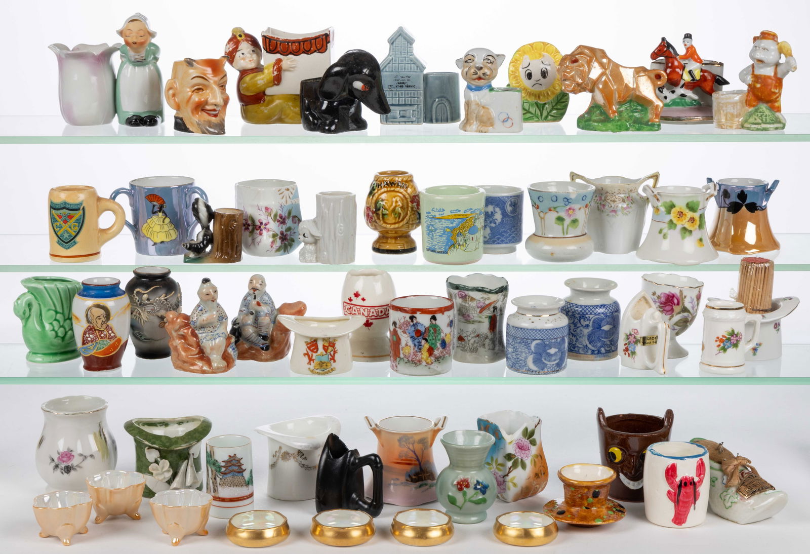 CHINESE AND JAPANESE CERAMIC TOOTHPICK / MATCH HOLDERS, UNCOUNTED LOT: CHINESE AND JAPANESE CERAMIC TOOTHPICK / MATCH HOLDERS, UNCOUNTED LOT, more than 50, including two hand-painted moriage examples including one featuring a dragon, one double-handled example featuring