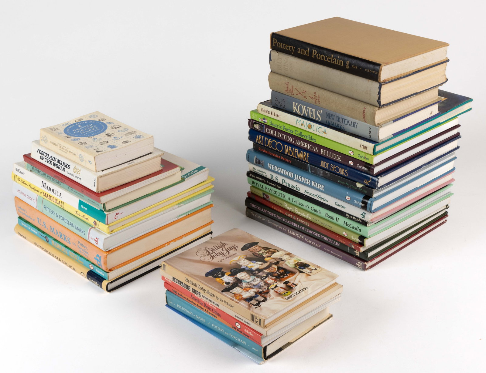ASSORTED CERAMICS REFERENCE VOLUMES, LOT OF 33: ASSORTED CERAMICS REFERENCE VOLUMES, LOT OF 33, including Majolica, Limoges, Royal Bayreuth, R.S. Prussia, Wedgwood Jasper Ware, KTK, American Belleek, marks, etc. Hard and soft covers. Provenance: Th