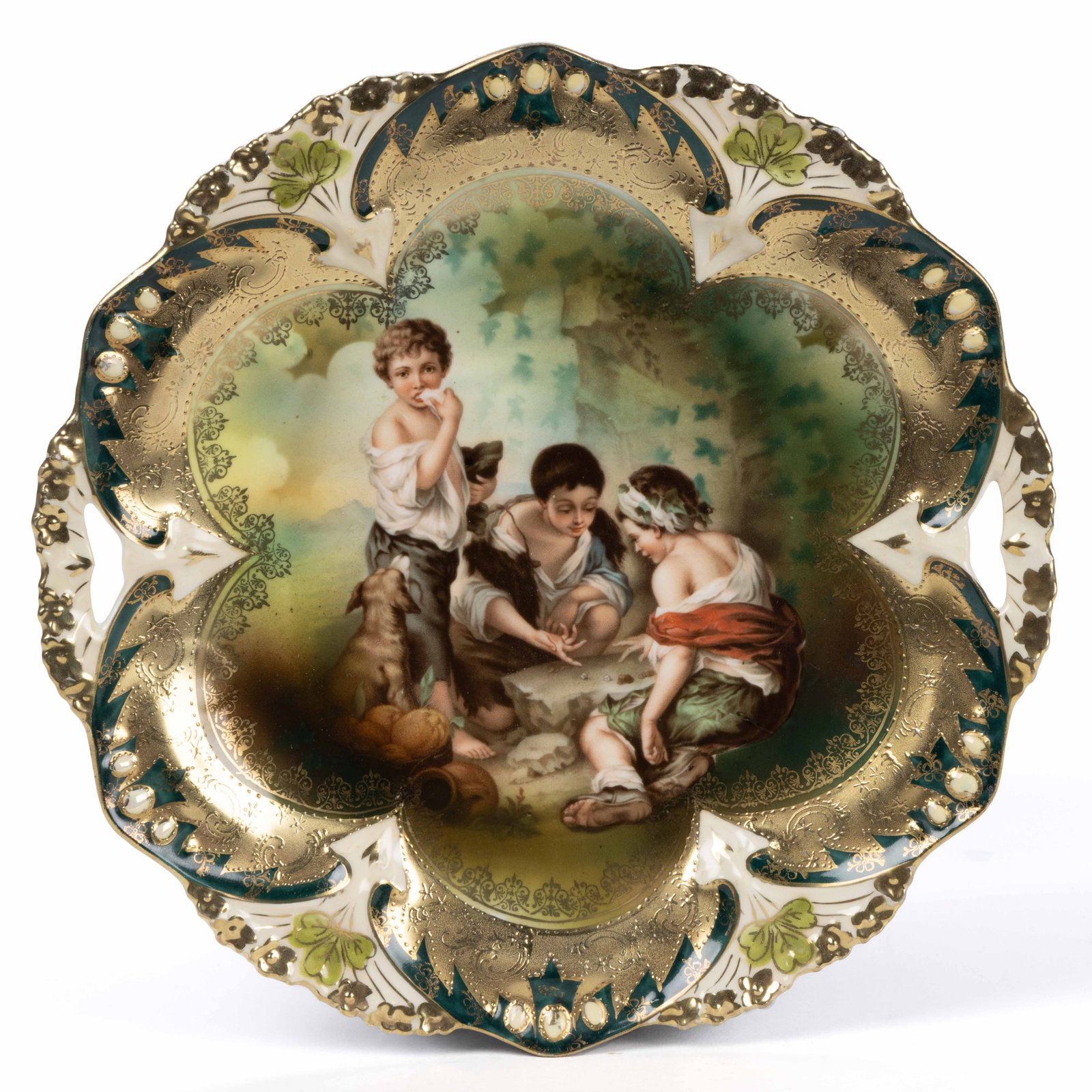 R.S. PRUSSIA PORCELAIN "DICE THROWERS" CAKE PLATE: R.S. PRUSSIA PORCELAIN "DICE THROWERS" CAKE PLATE, RSP Mold 82, open-handled form having polychrome transfer depicting Murillo's "Dice Throwers" featuring children playing games, with background shade