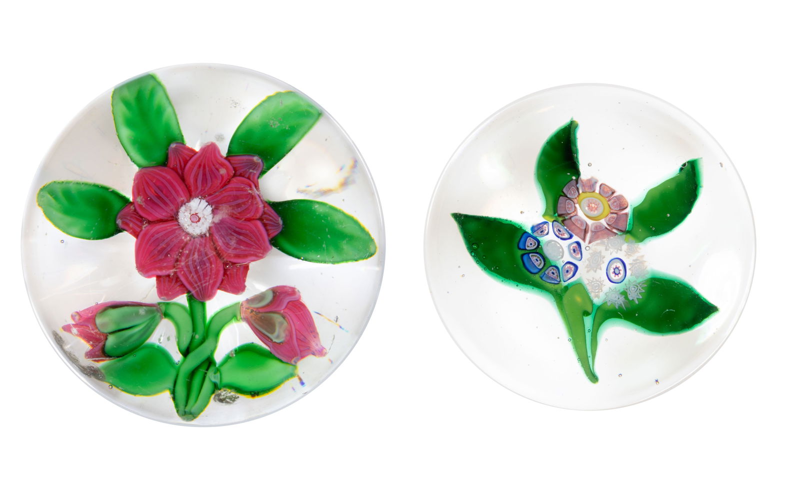 ANTIQUE LAMPWORK AND MILLEFIORI ART GLASS PAPERWEIGHTS, LOT OF TWO: ANTIQUE LAMPWORK AND MILLEFIORI ART GLASS PAPERWEIGHTS, LOT OF TWO, comprising a Saint-Louis nosegay miniature example with four green leaves, and a Baccarat Double Clematis in red with six green leav