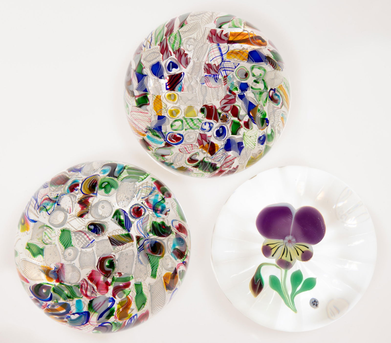VINTAGE BACCARAT ART GLASS PAPERWEIGHTS, LOT OF THREE: VINTAGE BACCARAT ART GLASS PAPERWEIGHTS, LOT OF THREE, comprising two scrambled examples with many colors of filigree and opaque twists, and a lampworked Pansy example, each with an acid-stamped signa