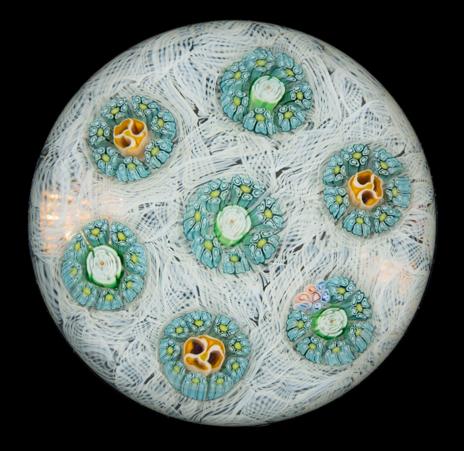 PARABELLE MILLEFIORI RONDELS STUDIO ART GLASS PAPERWEIGHT: PARABELLE MILLEFIORI RONDELS STUDIO ART GLASS PAPERWEIGHT, central white and green Clichy-style roses, surrounded by a single garland of blue and green complex canes, with six exterior rondels with th