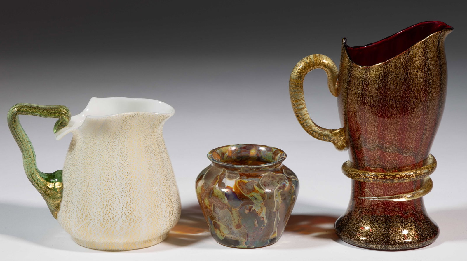 UNION GLASS COMPANY GOLD-FLECKED / VENETIAN-STYLE ART GLASS ARTICLES, LOT OF TWO: UNION GLASS COMPANY GOLD-FLECKED / VENETIAN-STYLE ART GLASS ARTICLES, LOT OF TWO, each with gold flecking across exterior surface, both with Panel-Optic molding to bodies with the pinch-waisted ruby r