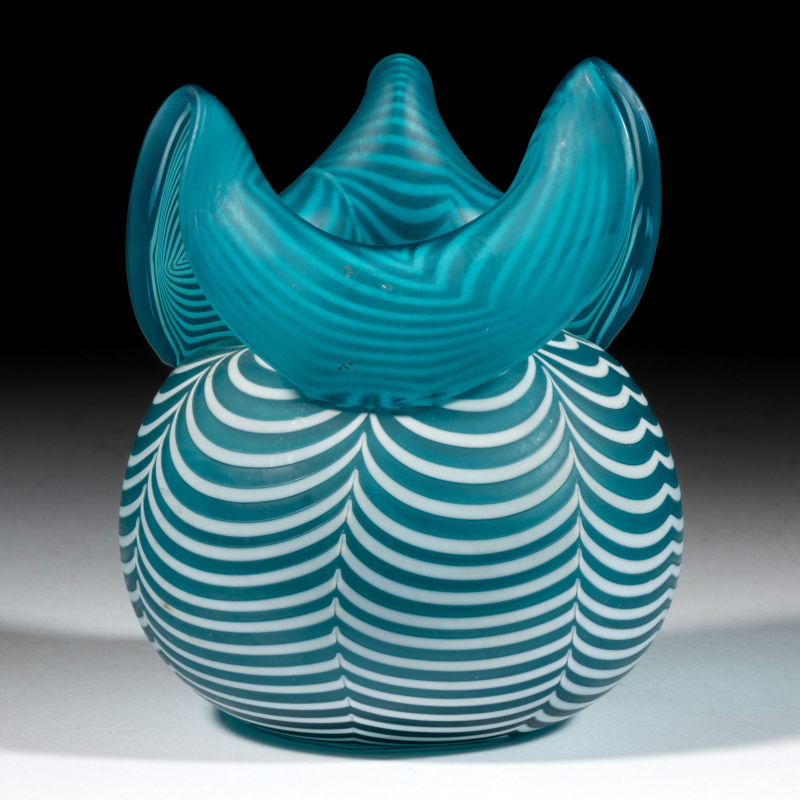 NAILSEA / VENETIAN THREAD ART GLASS VASE / BOWL: NAILSEA / VENETIAN THREAD ART GLASS VASE / BOWL, blue with opal loopings and satin finish, globular body with folded-down three-point tooled rim, rough pontil mark to underside. Maker unverified, prob