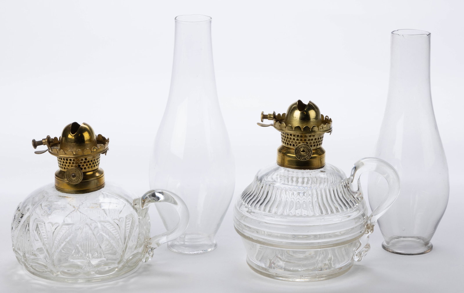 HOLMES, BOOTH & HAYDENS / ATWOOD NO. 0 LIP BURNER AND CHIMNEY SETUPS, LOT OF TWO: HOLMES, BOOTH & HAYDENS / ATWOOD NO. 0 LIP BURNER AND CHIMNEY SETUPS, LOT OF TWO, thumbwheels marked "HOLMES BOOTH & HAYDENS / PAT SEPR16/62. / ATWOOD'S PAT. AUGUST, 1./65.", colorless lip chimneys. E