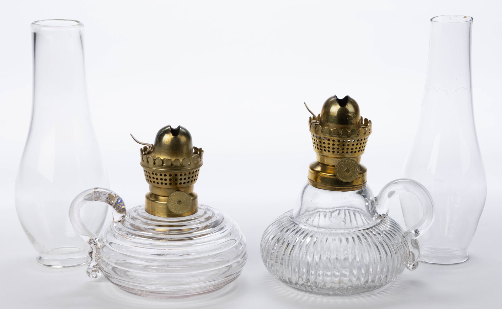HOLMES, BOOTH & HAYDENS / E. F. JONES NO. 0 LIP BURNER AND CHIMNEY SETUPS, LOT OF TWO: HOLMES, BOOTH & HAYDENS / E. F. JONES NO. 0 LIP BURNER AND CHIMNEY SETUPS, LOT OF TWO, thumbwheel marked "HOLMES BOOTH & HAYDENS. / PAT. JAN. 24. 1860 / E. F. JONES PAT. JAN. 11TH 1859.", each with a 