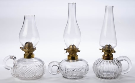 ASSORTED PATTERNED KEROSENE FINGER LAMPS, LOT OF THREE