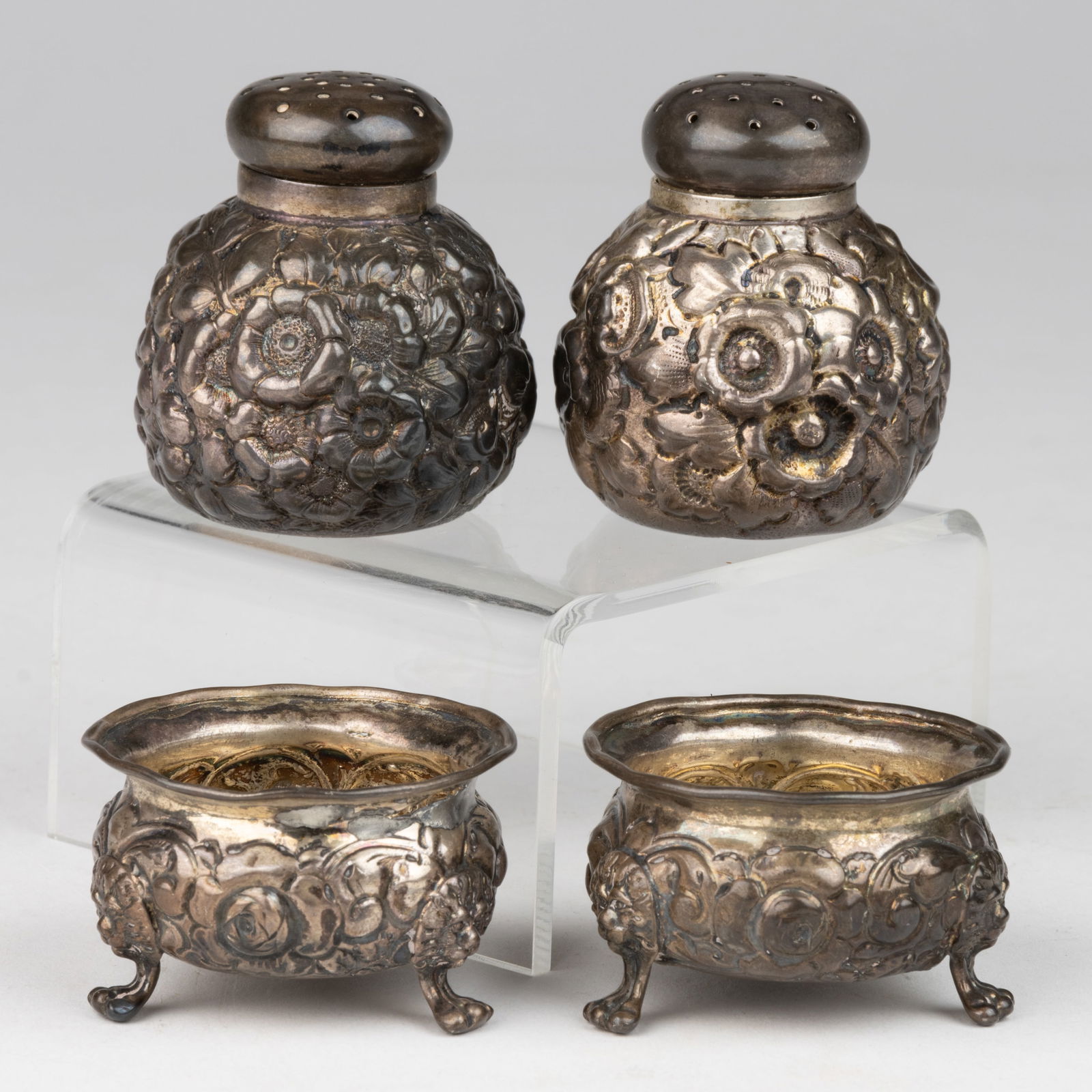 GEORGE W. SHIEBLER & CO. AND OTHER REPOUSSE STERLING SILVER SHAKERS AND OPEN SALTS, LOT OF FOUR (1 of 2)