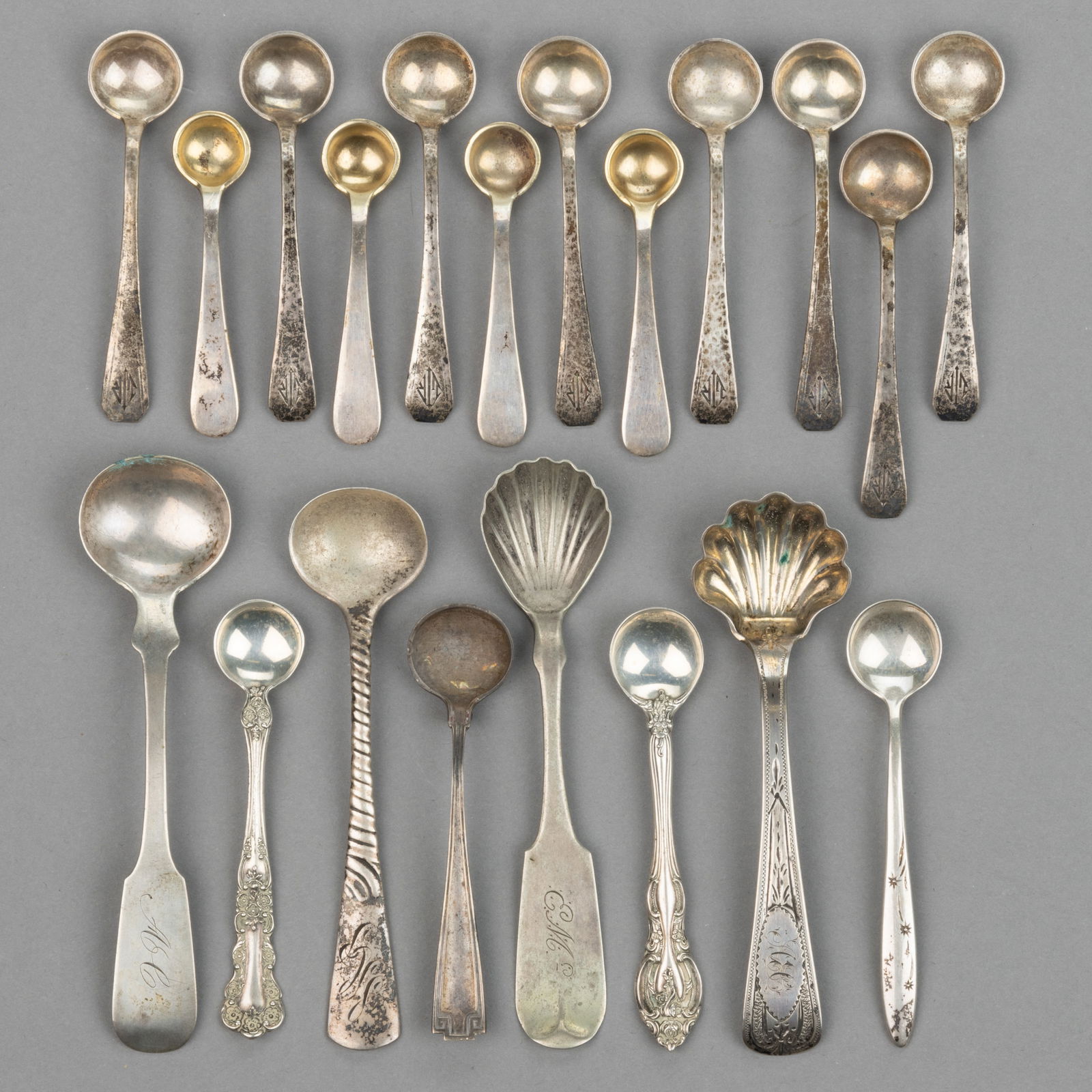 GORHAM AND OTHER STERLING AND COIN SILVER SALT SPOONS, LOT OF 20: GORHAM AND OTHER STERLING AND COIN SILVER SALT SPOONS, LOT OF 20, sterling pieces comprising a set of eight spoons by Durgin which was bought by Gorham in 1905 with engraved "LIR" initials,