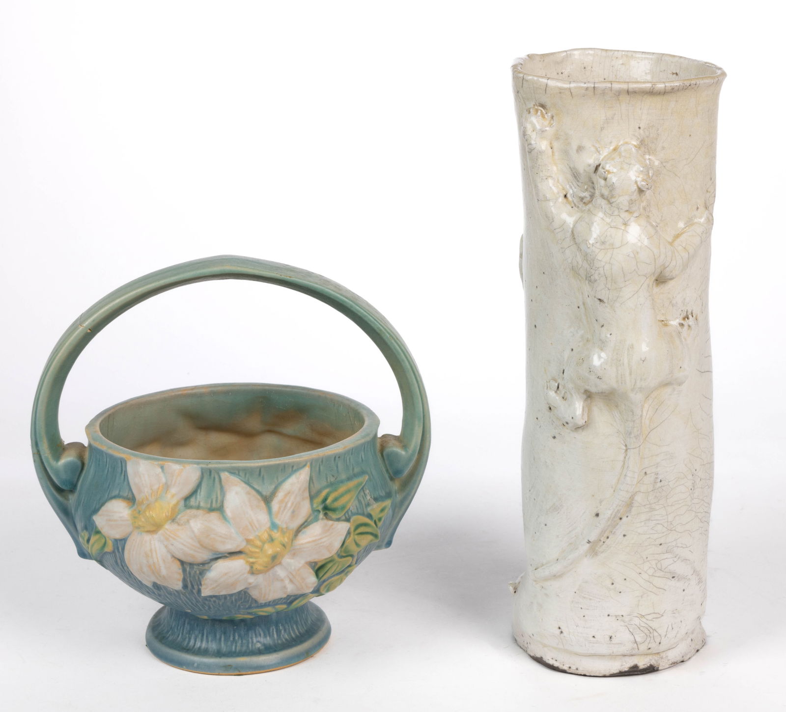 AMERICAN ROSEVILLE ART POTTERY CLEMATIS BASKET: AMERICAN ROSEVILLE ART POTTERY CLEMATIS BASKET, footed form, featuring large white flowers on a leafy vine on turquoise ground to each side, embossed 'Roseville / U.S.A. / 389-10"' to und