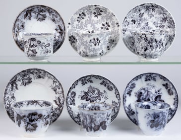 BRITISH MULBERRY IRONSTONE FLORAL MOTIF CUP AND SAUCER SETS, LOT OF SIX