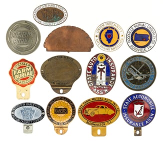 ASSORTED LICENSE PLATE / TAG TOPPERS AND AUTOMOBILE INSURANCE EMBLEMS, LOT OF 13
