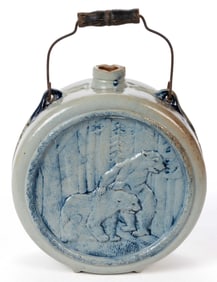 AMERICAN WHITE'S POTTERY, UTICA, NEW YORK MOLDED STONEWARE BEAR MOTIF CANTEEN