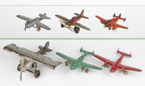 ASSORTED HUBLEY CAST-IRON AND CAST-METAL TOY AIRPLANES, LOT OF SIX