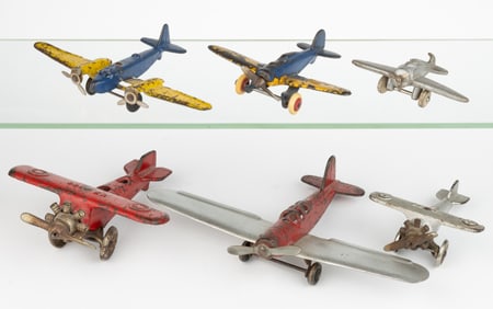 ASSORTED ARCADE AND OTHER CAST-IRON / PRESSED-STEEL TOY AIRPLANES, LOT OF SIX