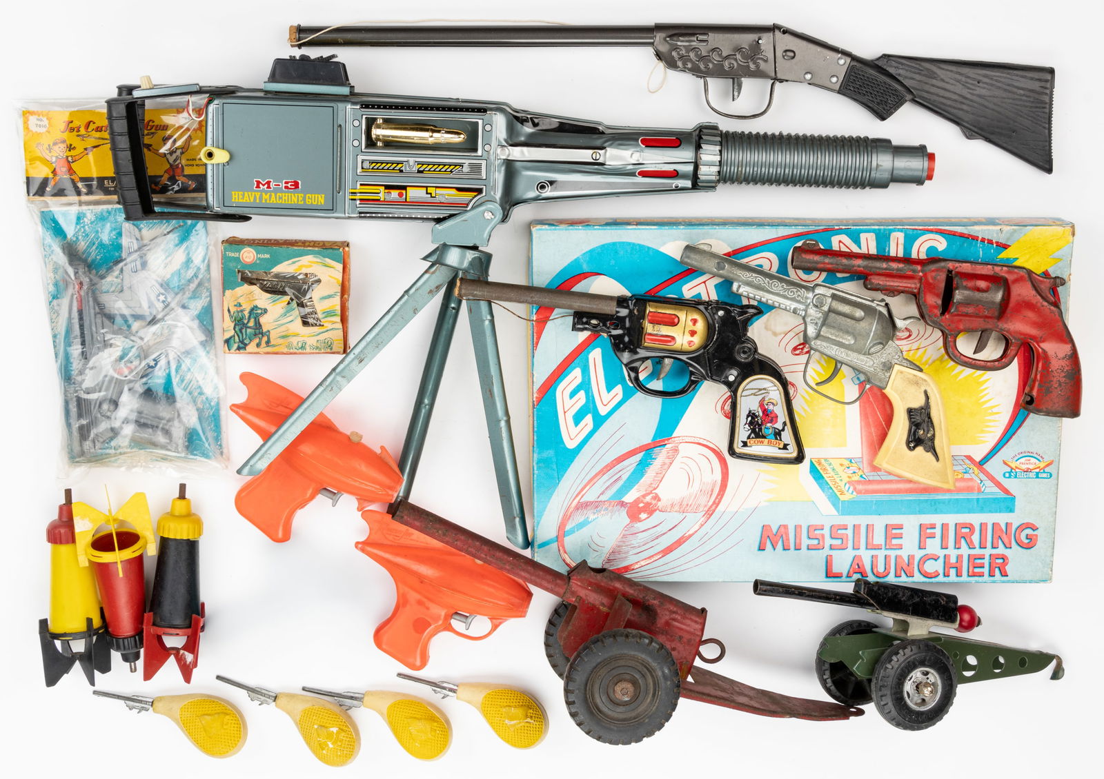 ASSORTED TOY GUNS AND WEAPONS, UNCOUNTED LOT: ASSORTED TOY GUNS AND WEAPONS, UNCOUNTED LOT, including a pressed-steel gun which clicks when the trigger is pulled; a battery-operated M-3 machine gun; a Yacht repeating cap gun in its original box;