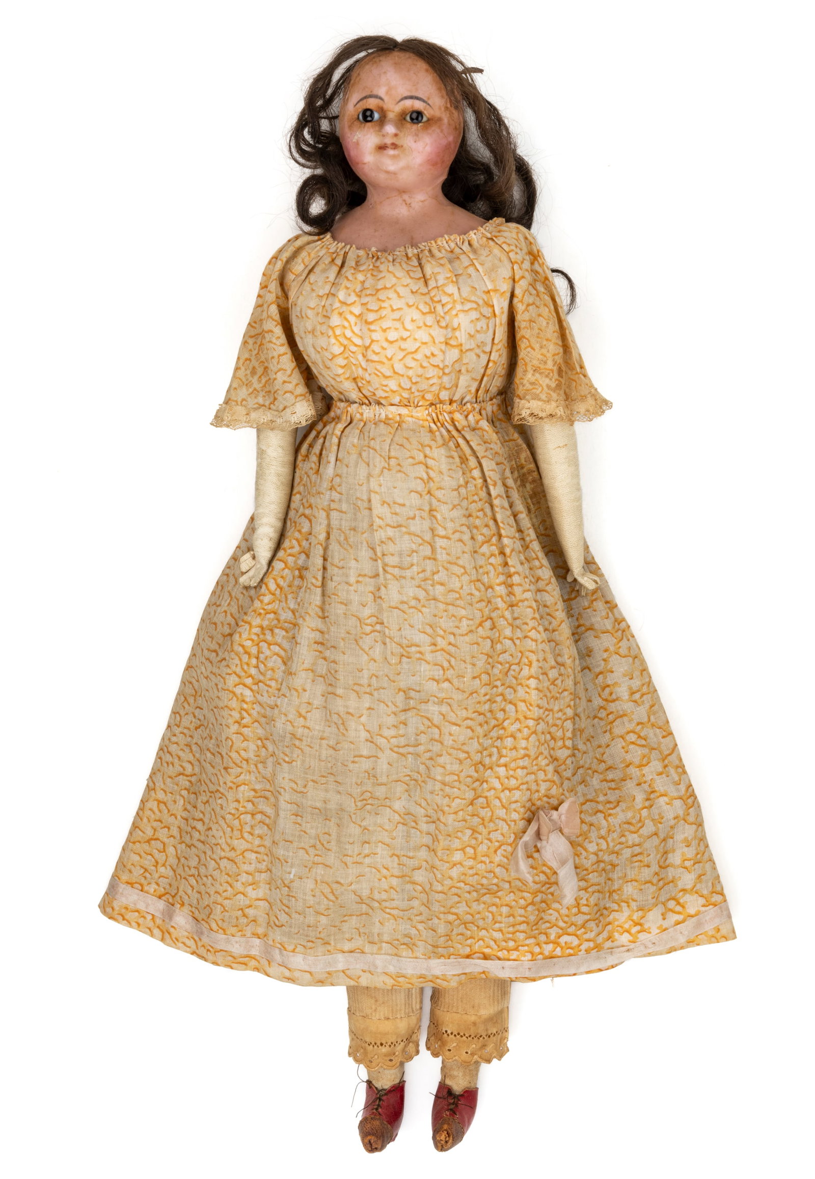 WAX-OVER-PAPER MACHE SLIT-HEAD DOLL: WAX-OVER-PAPER MACHE SLIT-HEAD DOLL, wax over paper mache shoulder head, fixed brown glass eyes, painted eyebrows, closed mouth, jointed cloth body stuffed with sawdust, leather arms, top of head with