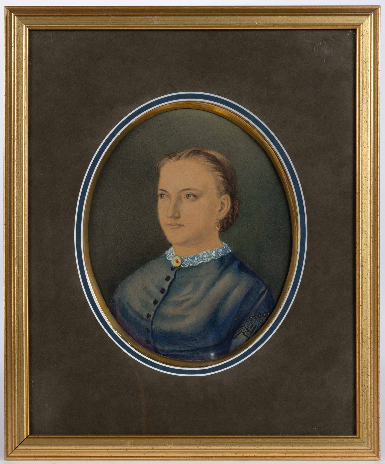 AMERICAN SCHOOL (19TH CENTURY) PORTRAIT OF A LADY: AMERICAN SCHOOL (19TH CENTURY) PORTRAIT OF A LADY, watercolor and gouache on paper, an oval bust depiction of a lady with her hair in a bun, blue dress with lace collar, and matching brooch and earrin