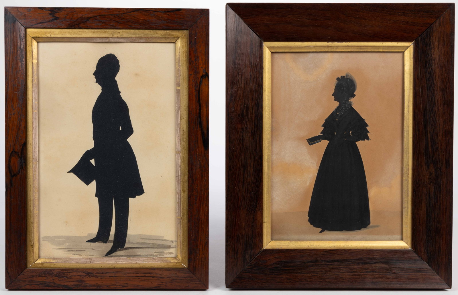 HUBARD AND CROWHURST BRITISH CUT-AND-PASTED SILHOUETTES, LOT OF TWO: HUBARD AND CROWHURST BRITISH CUT-AND-PASTED SILHOUETTES, LOT OF TWO, cut-paper with watercolor accents, each a full-length depiction of a formally dressed sitter, the portrait of the man with a waterm