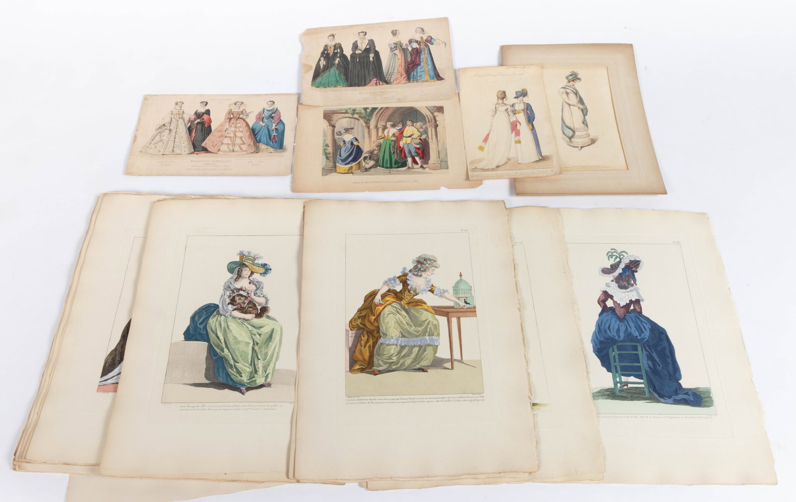 ANTIQUE FRENCH AND OTHER FASHION PLATES AND SATIRICAL PRINTS, UNCOUNTED LOT: ANTIQUE FRENCH AND OTHER FASHION PLATES AND SATIRICAL PRINTS, UNCOUNTED LOT, engraving on paper with hand-color accents, featuring mostly women subjects, including nine prints from the satirical serie