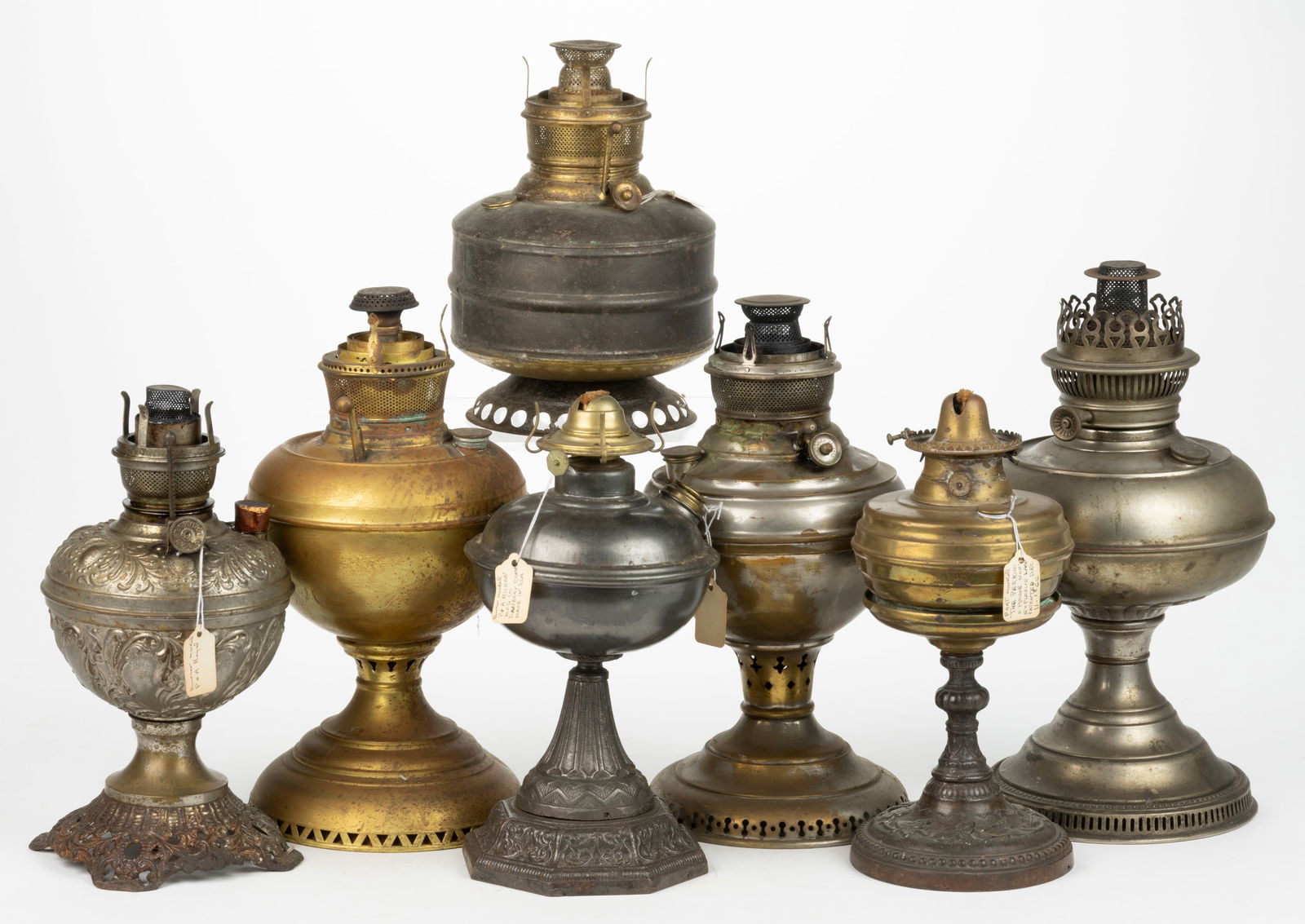 ASSORTED BRASS AND SHEET-IRON KEROSENE STAND LAMPS, LOT OF SEVEN (1 of 1)
