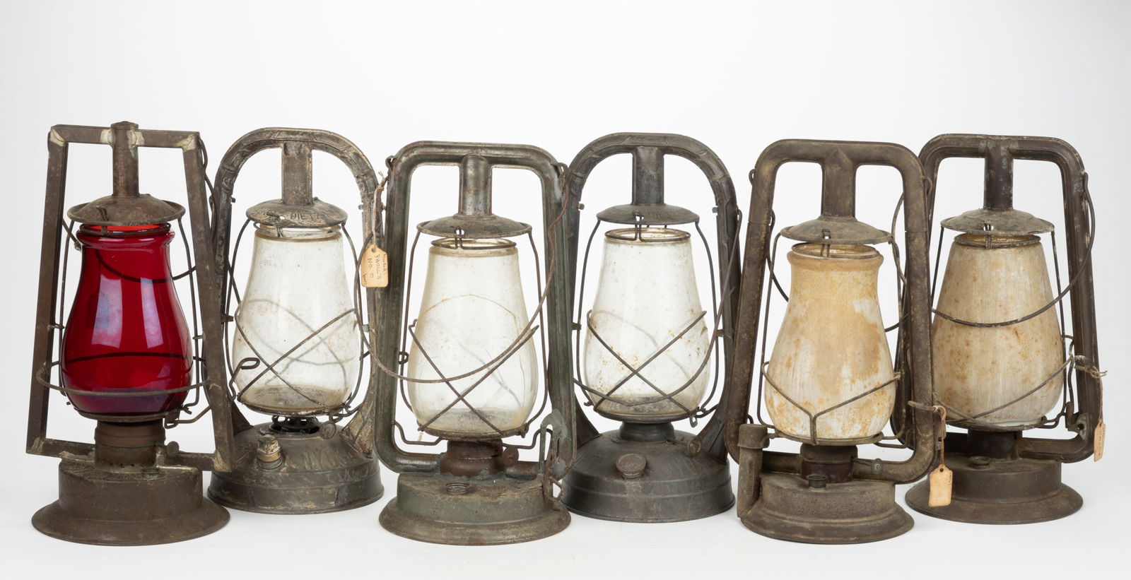 ASSORTED MANUFACTURERS SHEET-IRON HOT-BLAST TUBULAR LANTERNS, LOT OF SIX: ASSORTED MANUFACTURERS SHEET-IRON HOT-BLAST TUBULAR LANTERNS, LOT OF SIX, comprising of three Dietz examples including two Monarchs and a Royal examples; an Embury No. 0 example; a Buhl Conques exampl