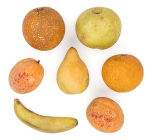 ASSORTED CARVED AND PAINTED FIGURAL STONE FRUIT, LOT OF SEVEN