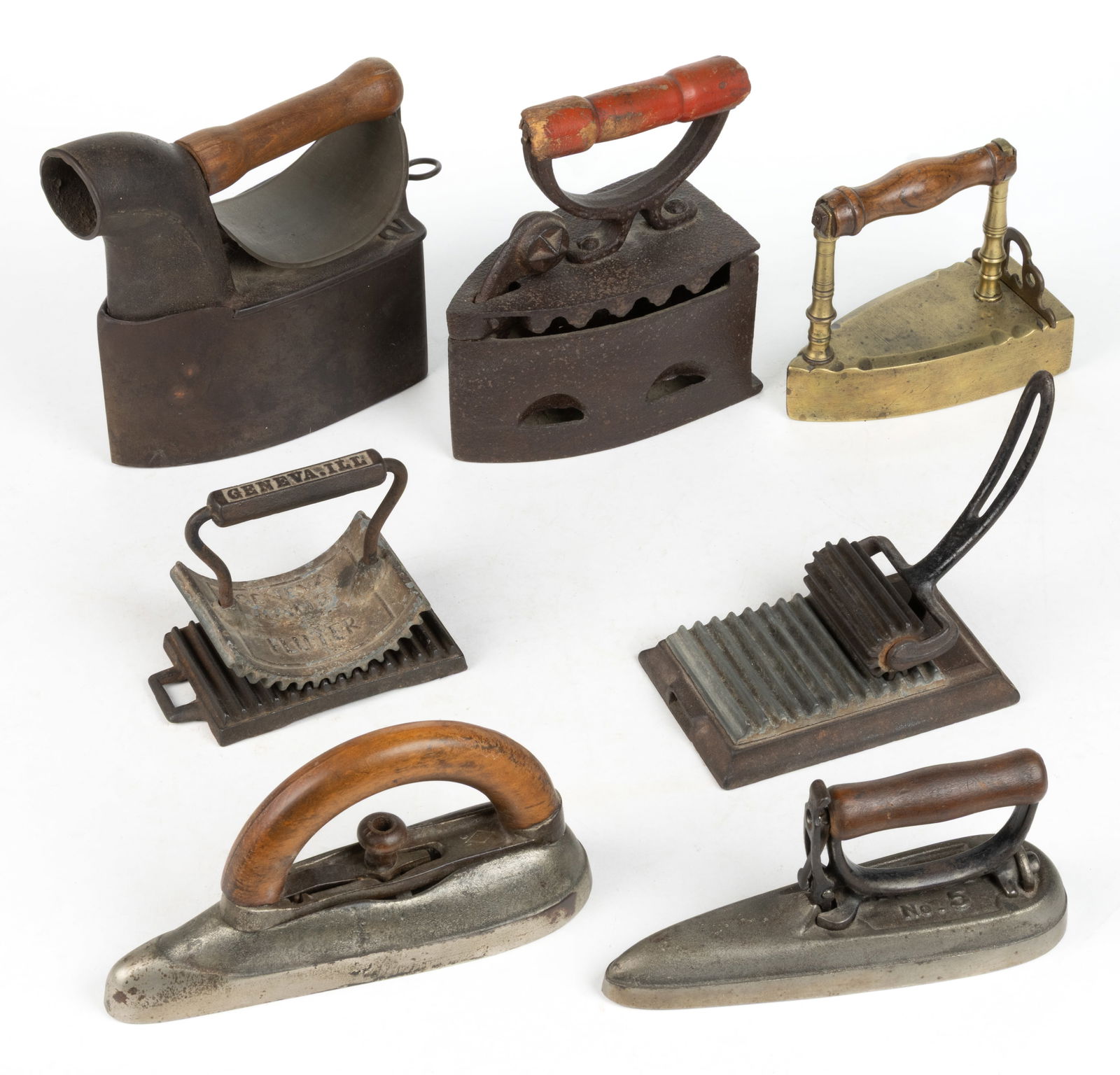 ASSORTED BRASS AND CAST-IRON SAD / FLAT IRONS AND FLUTERS, LOT OF SEVEN (1 of 2)