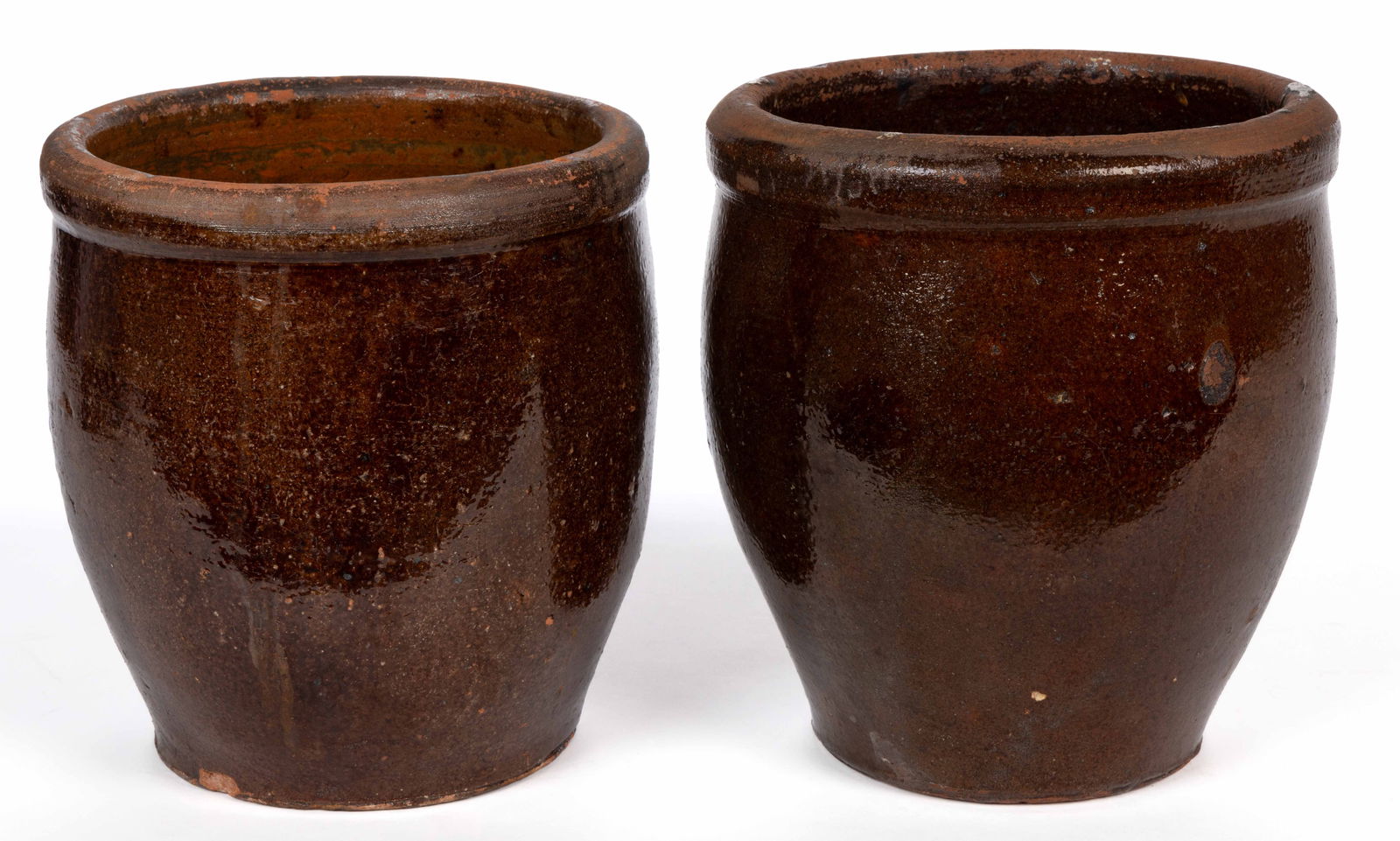 SHENANDOAH VALLEY OF VIRGINIA EARTHENWARE / REDWARE CROCKS, LOT OF TWO: SHENANDOAH VALLEY OF VIRGINIA EARTHENWARE / REDWARE CROCKS, LOT OF TWO, double lead-glazed, each approximately one-gallon capacity, wide-mouth form with collared rim, and clamshell-pattern c