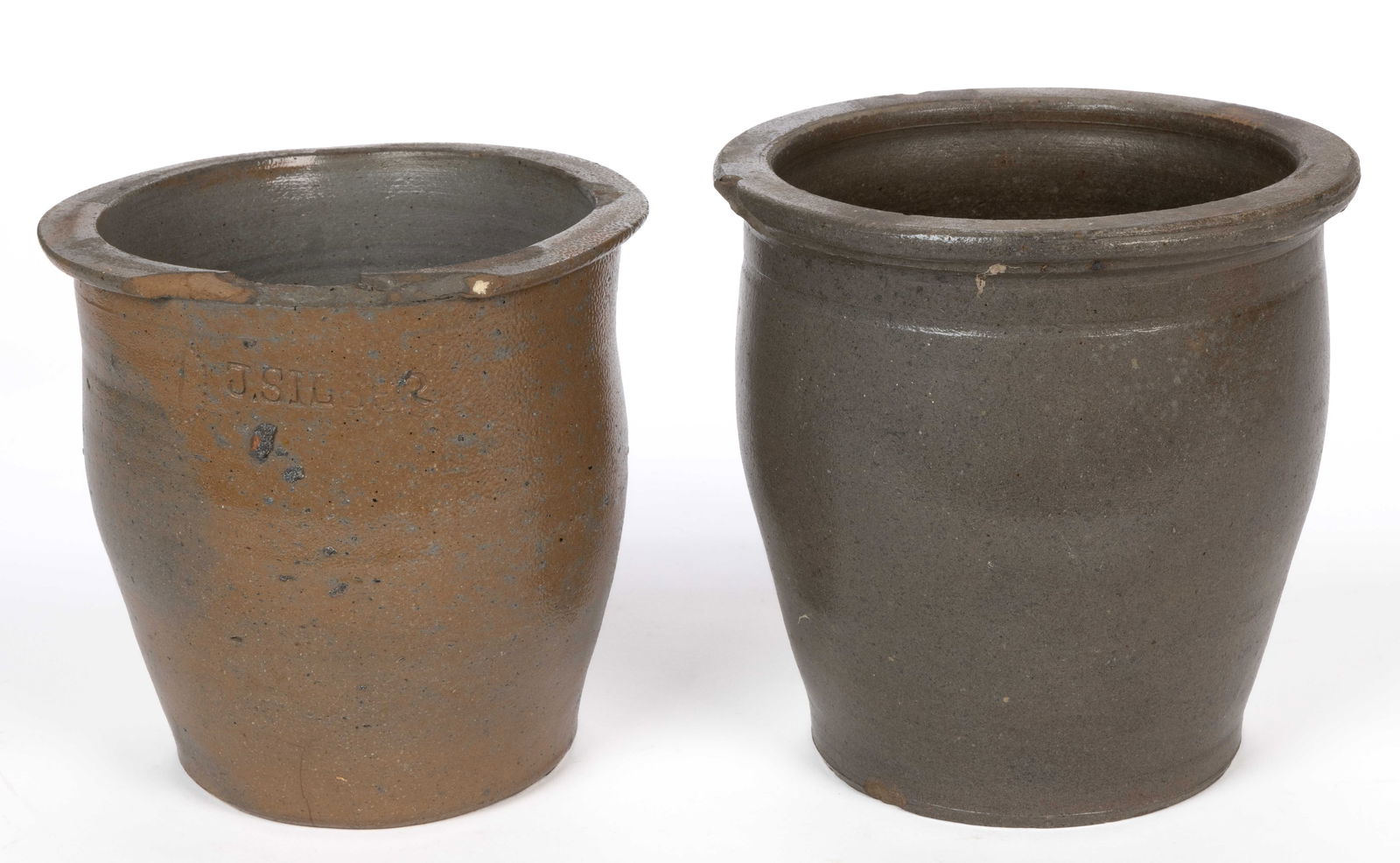 JOSEPH SILBER, ROCKINGHAM CO., SHENANDOAH VALLEY OF VIRGINIA STONEWARE CROCKS, LOT OF TWO: JOSEPH SILBER, ROCKINGHAM CO., SHENANDOAH VALLEY OF VIRGINIA STONEWARE CROCKS, LOT OF TWO, salt-glazed, each of one-gallon capacity wide-mouth form with squared flat rim, comprising one stamped "