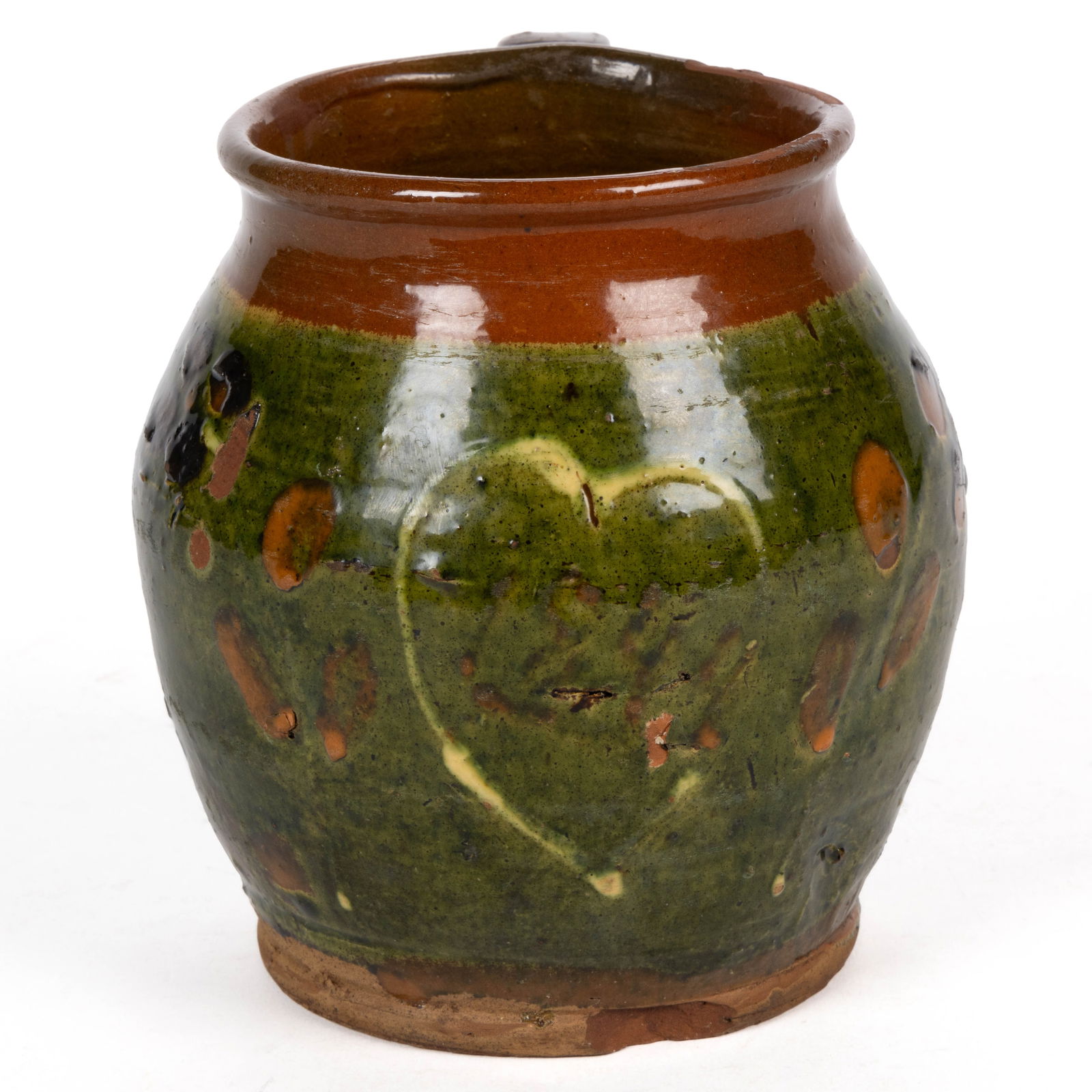 UNIDENTIFIED DECORATED EARTHENWARE / REDWARE JAR: UNIDENTIFIED DECORATED EARTHENWARE / REDWARE JAR, lead-, copper-, and manganese-glazed, ovoid form with rounded rim, applied strap handle, and pronounced beaded foot. Having a broad copper band with y