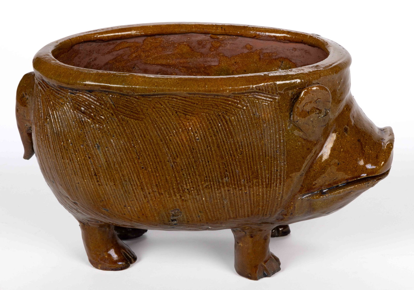 AMERICAN EARTHENWARE / REDWARE FIGURAL PIG PLANTER: AMERICAN EARTHENWARE / REDWARE FIGURAL PIG PLANTER, depicting a standing swine with incised fur and mouth, vertical ears, beady pinpoint eyes, and applied tail. Incised "RAS,? BRO CLAYWORKS