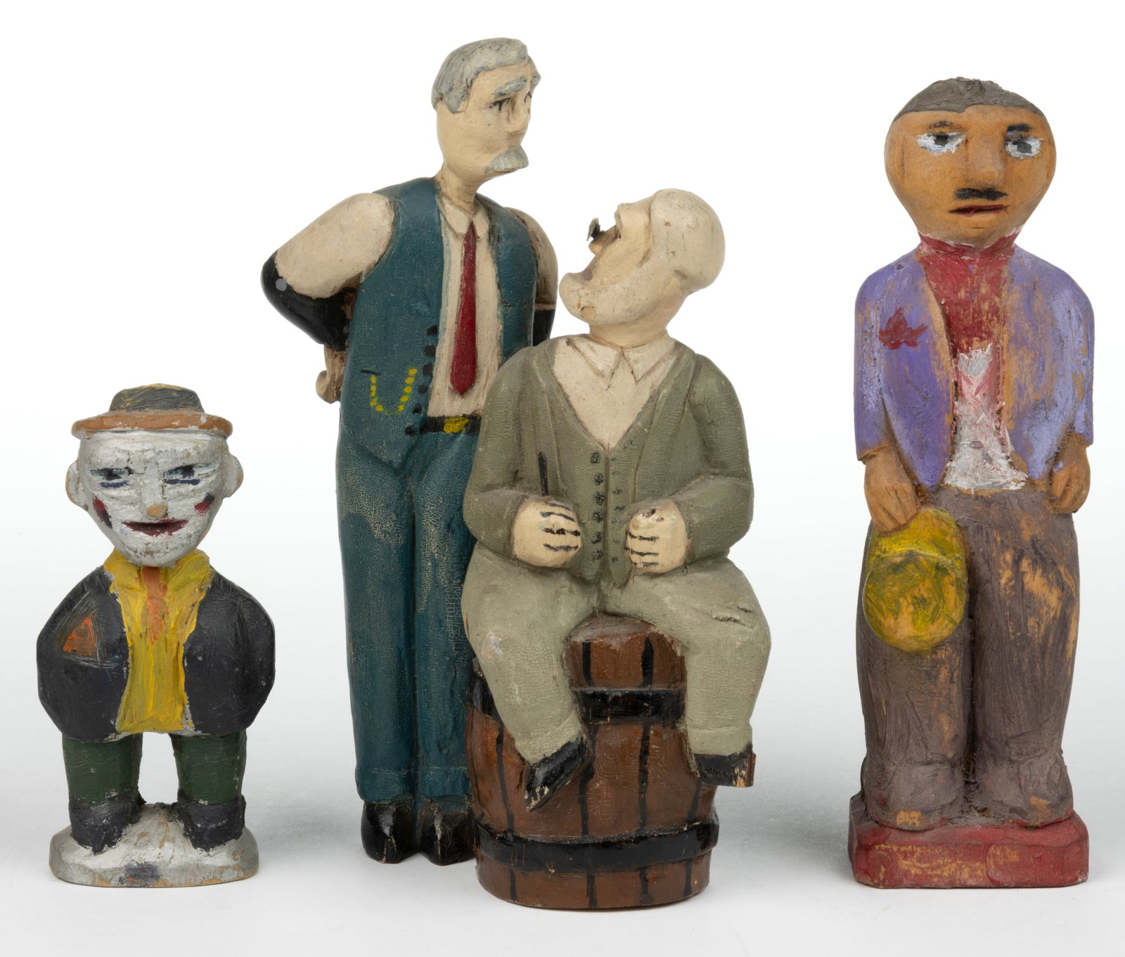 AMERICAN FOLK ART CARVED AND PAINTED FIGURES, LOT OF THREE: AMERICAN FOLK ART CARVED AND PAINTED FIGURES, LOT OF THREE, comprising a short man in a sun hat with his hands in his pockets, having silver face paint (probably depicting a clown); a taller mustachio