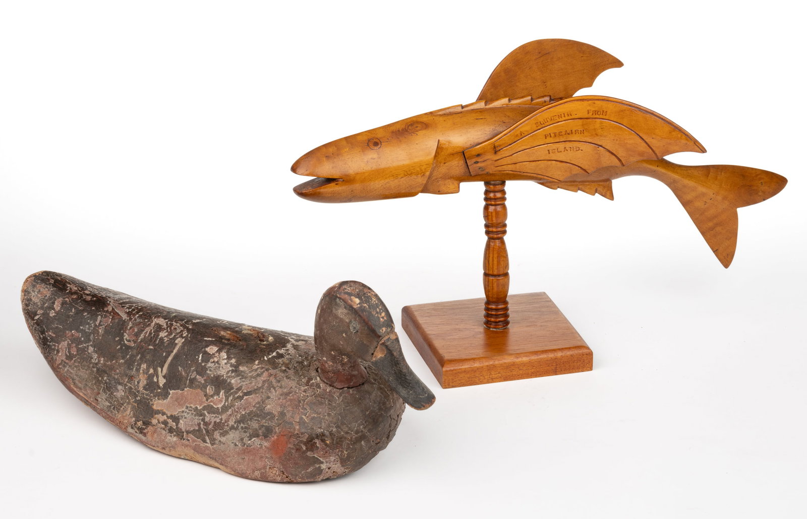 AMERICAN FOLK ART CARVED AND PAINTED DUCK DECOY: AMERICAN FOLK ART CARVED AND PAINTED DUCK DECOY, of full-bodied form with a separately carved head which mortises through the body, the beak appears to be applied to the rest of the head. Together wit