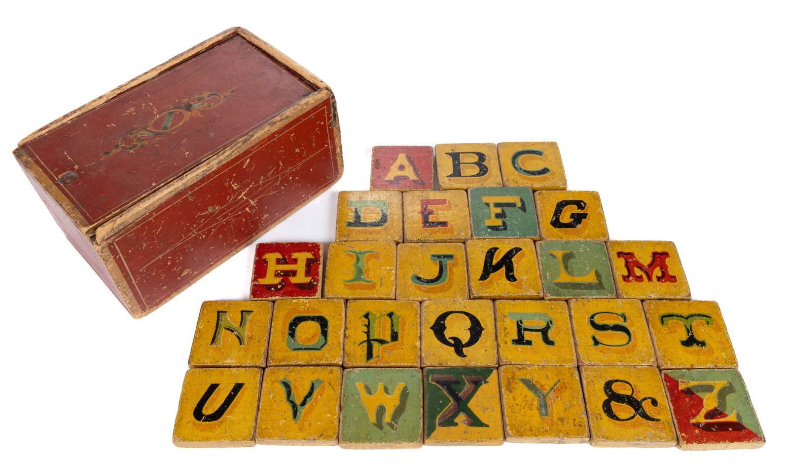 AMERICAN FOLK ART PAINT-DECORATED POPLAR BOX: AMERICAN FOLK ART PAINT-DECORATED POPLAR BOX, slide-lid form, nailed construction, retaining original polychrome surface and 27 period paint-decorated children's teaching blocks. Third quarter 19t
