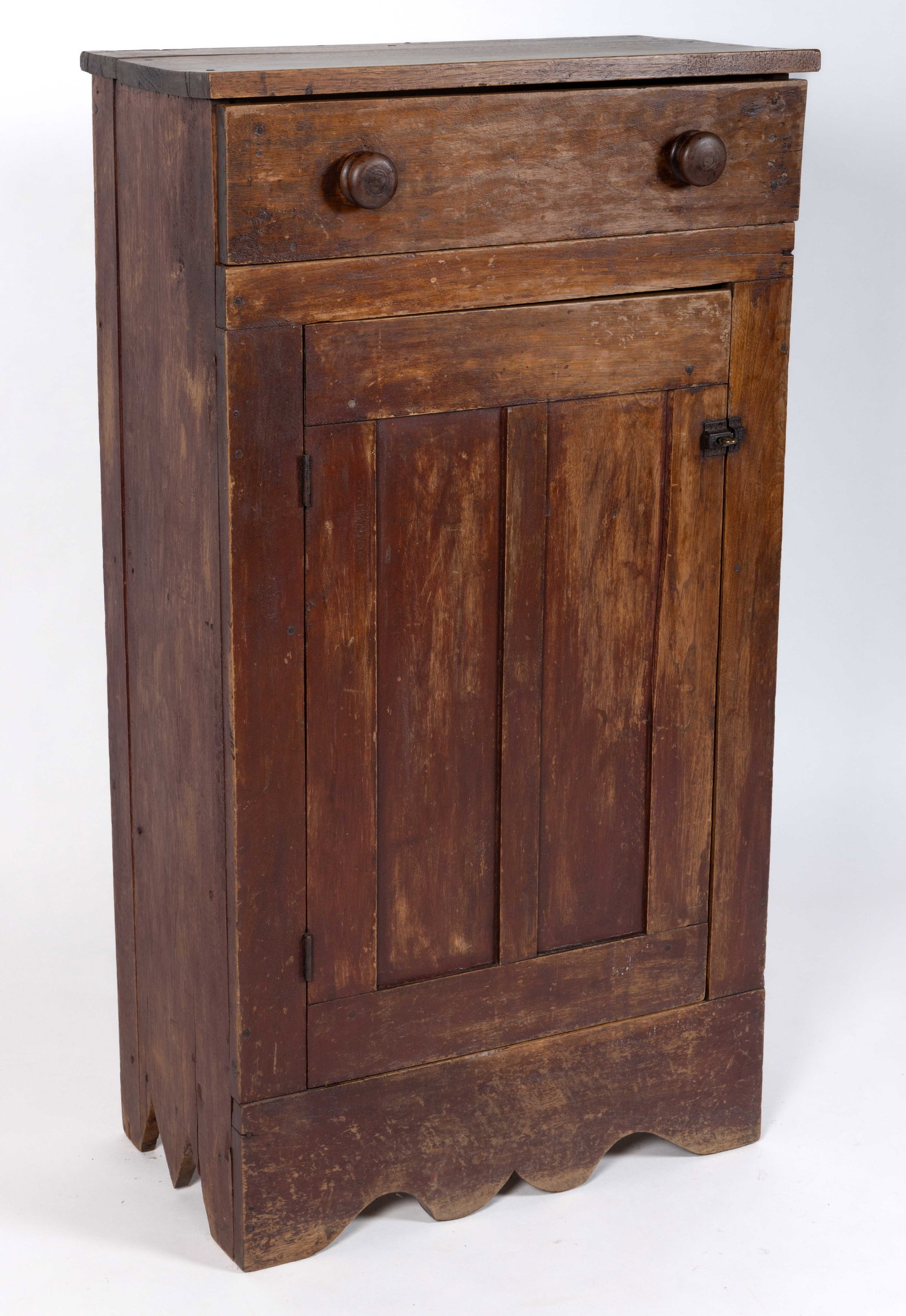 SOUTHERN WALNUT DIMINUTIVE JELLY CUPBOARD: SOUTHERN WALNUT DIMINUTIVE JELLY CUPBOARD, with two-board rectangular top and single full drawer over a fielded-panel door concealing two fixed shelves, flanked by solid ends, raised on a cut-out brac