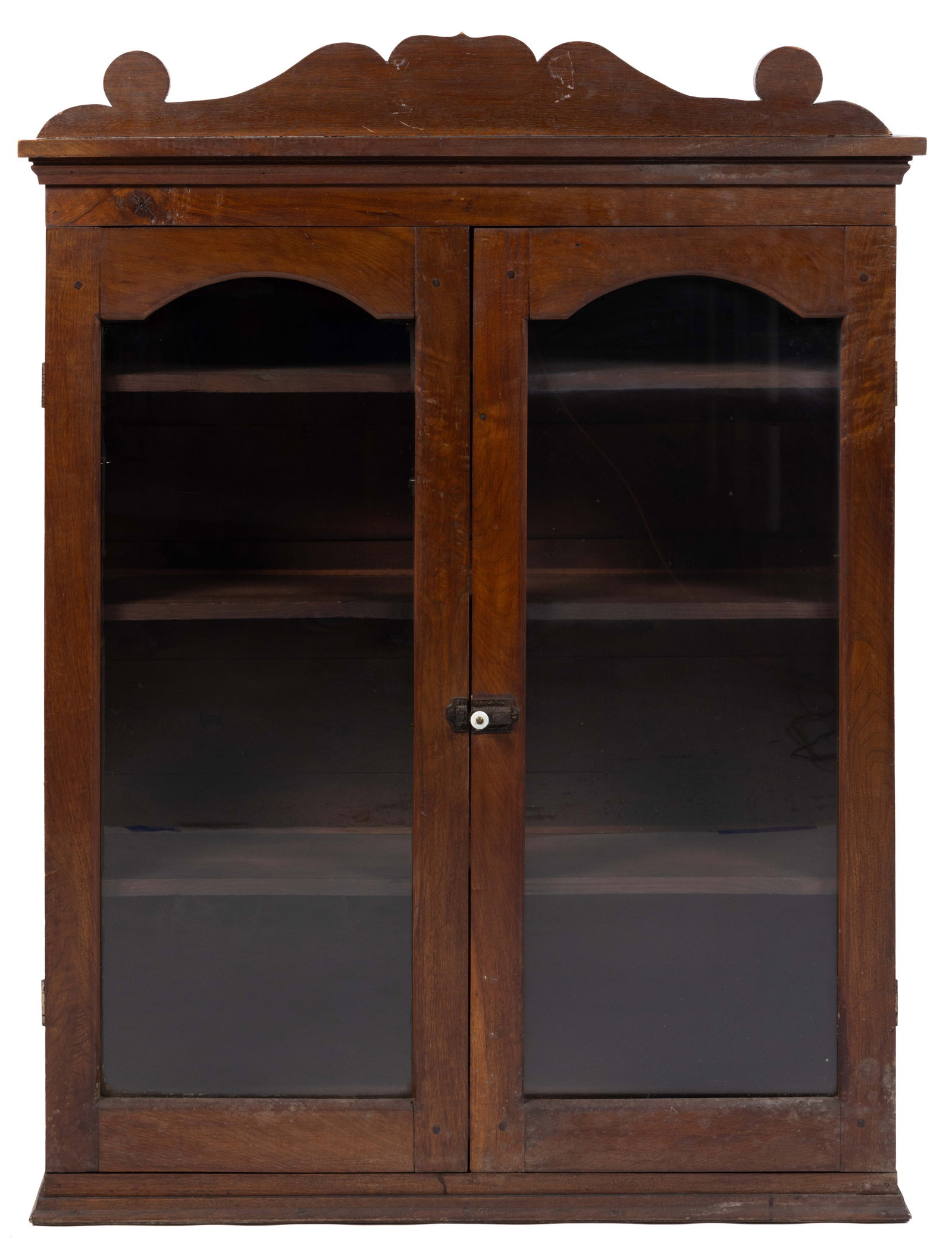 MID-ATLANTIC WALNUT CUPBOARD / PRESS TOP: MID-ATLANTIC WALNUT CUPBOARD / PRESS TOP, the rectangular top having an applied shaped crest over a molded cornice, two arch-top glazed hinged cabinet doors which conceal three fixed shelves with