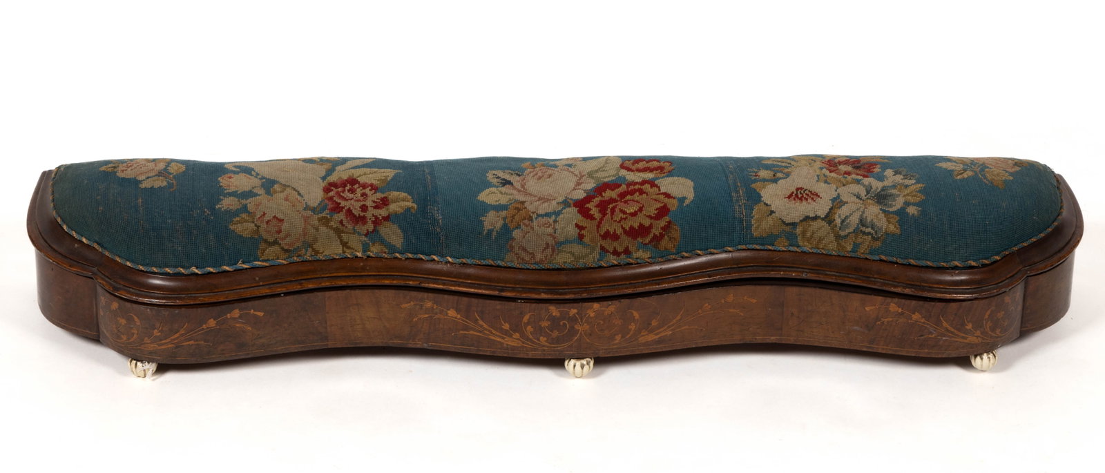 ENGLISH INLAID MAHOGANY-VENEERED FENDER STOOL: ENGLISH INLAID MAHOGANY-VENEERED FENDER STOOL, of elongated form with a serpentine molded edge on the lid which opens to reveal an open interior, the serpentine front inlaid with marquetry floral desi